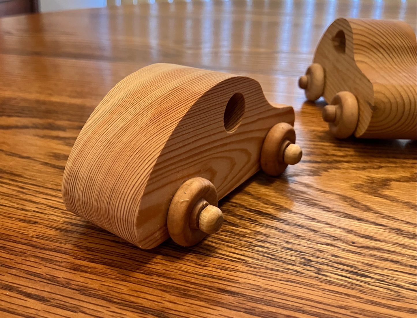 Wooden toy cars on a wooden table