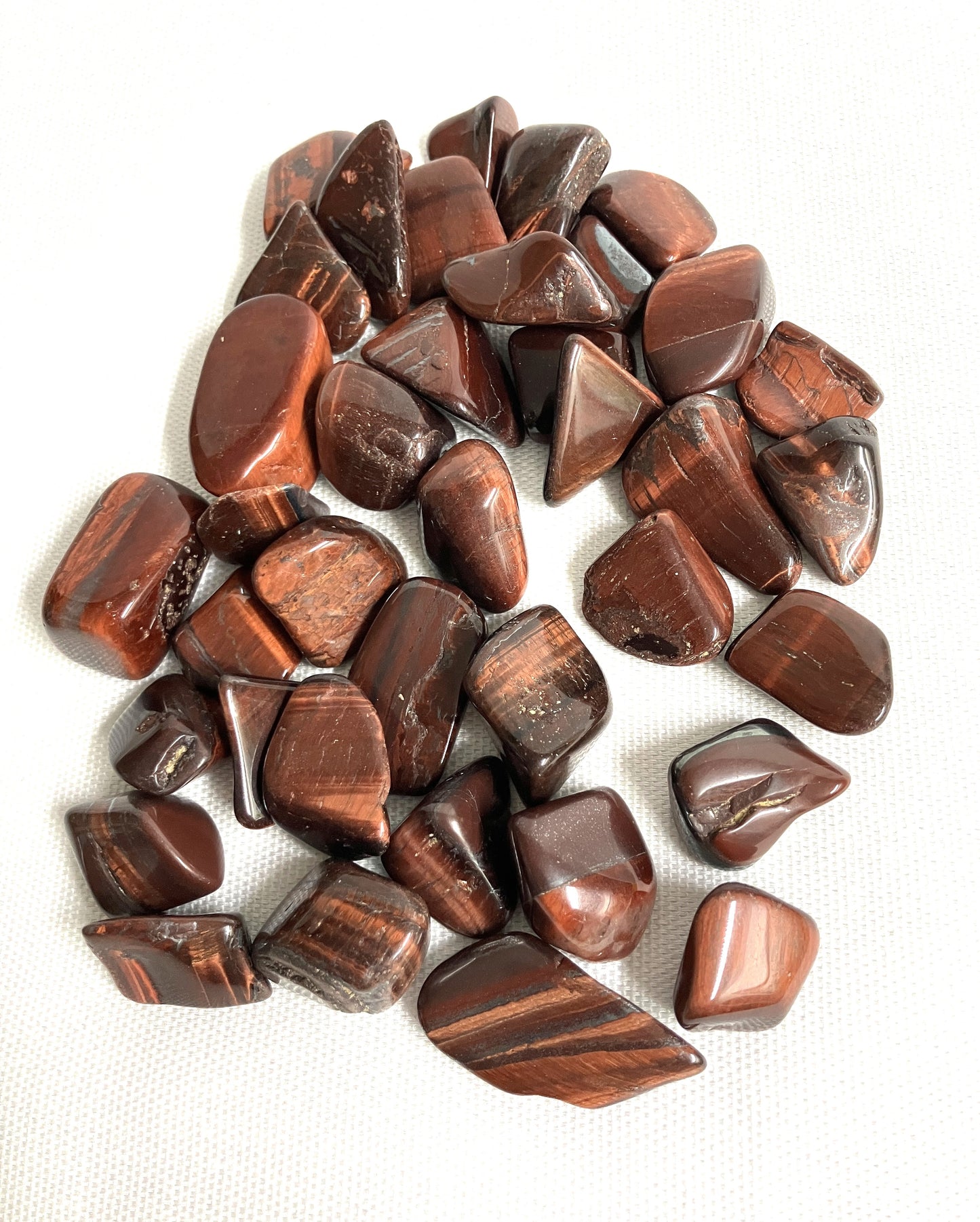 View of assorted red Tiger Eye Crystals