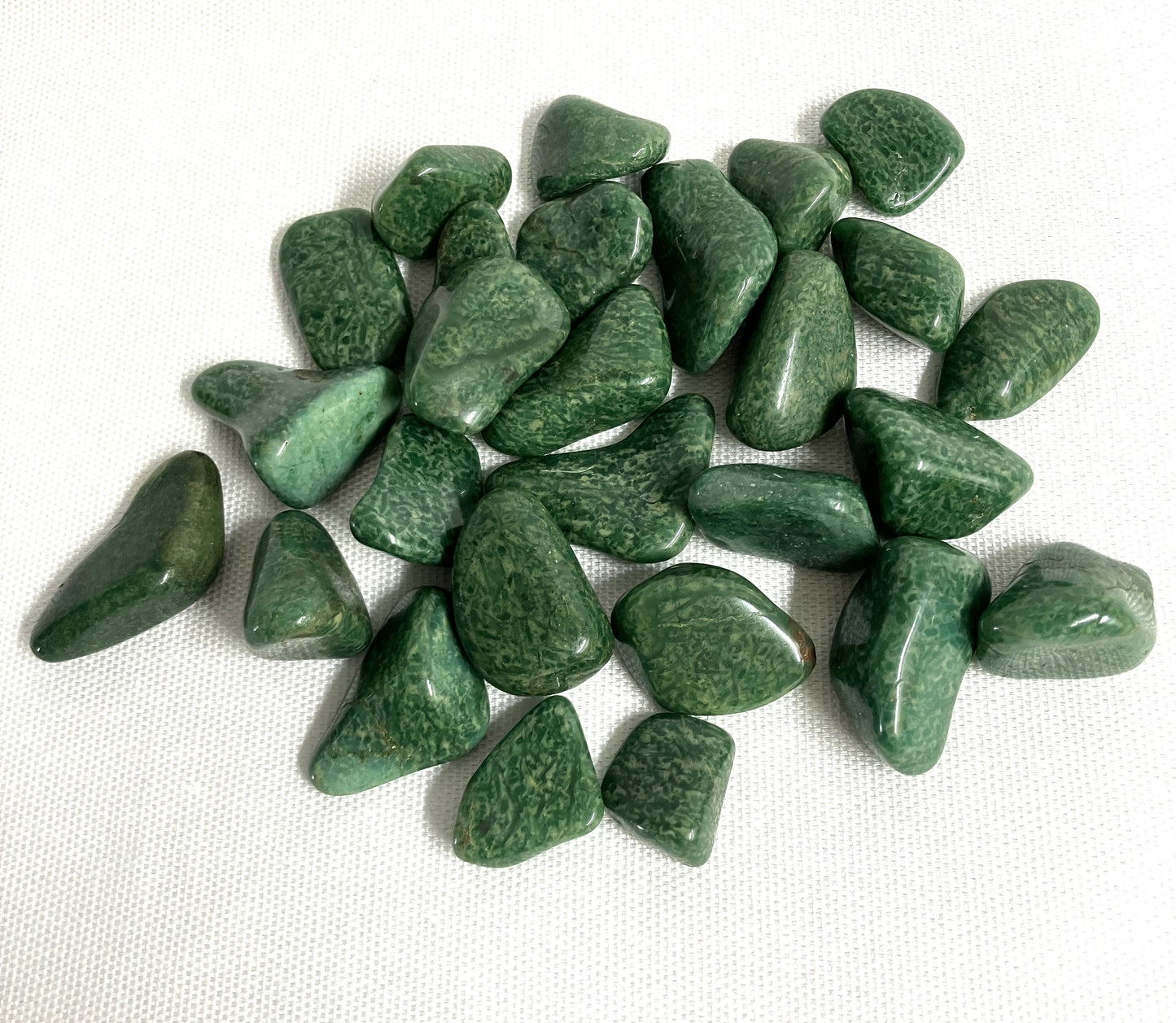 Back side of Verde Quartz Crystals on a white background