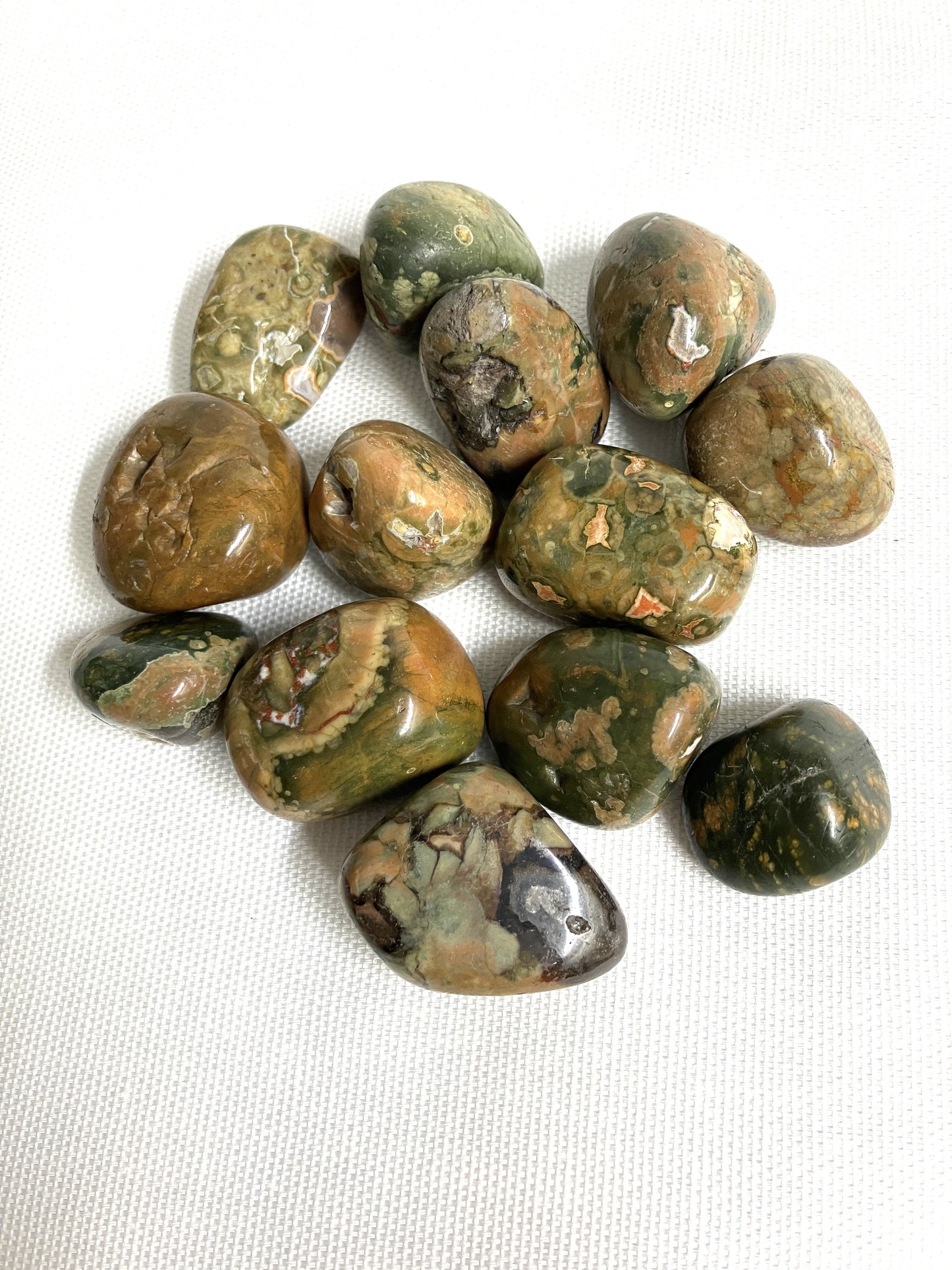 Back side if Rhyolite Crystals on a white background