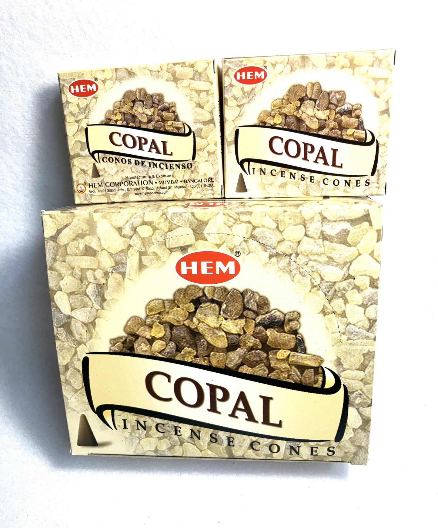 Master carton and two boxes of HEM Copal Incense Cones shown on a white background