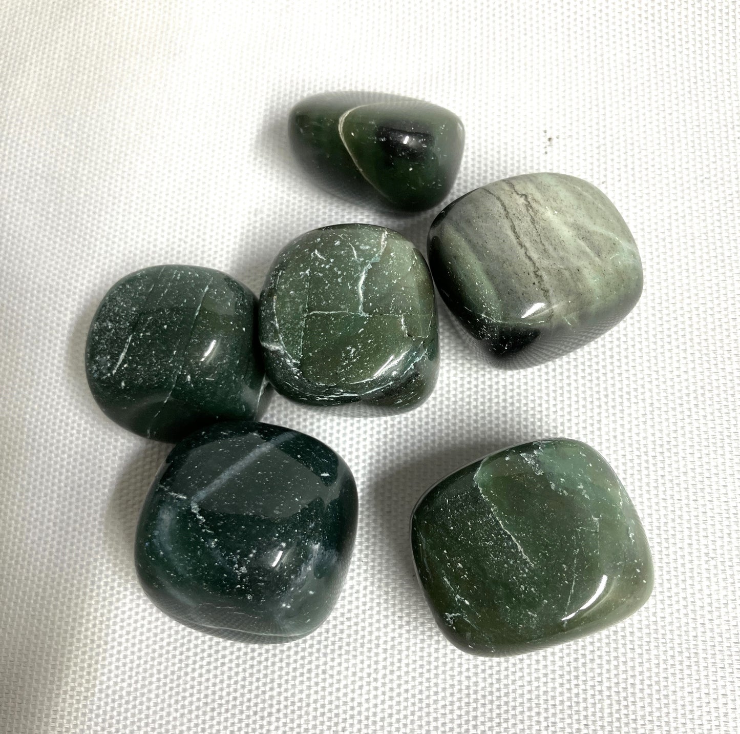 Closeup of Bowenite tumbled crystals
