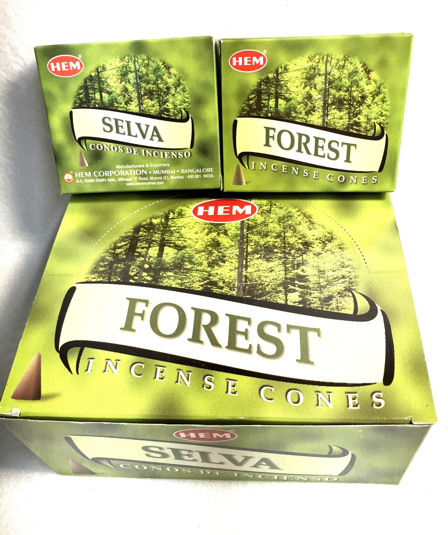 Master carton and two Boxes of HEM Forest incense cones showing both English and Spanish titles on a white background