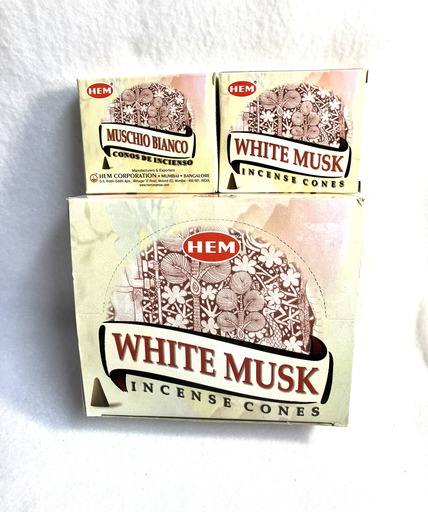 Master carton and two boxes of HEM White Musk incense cones shown on a white background