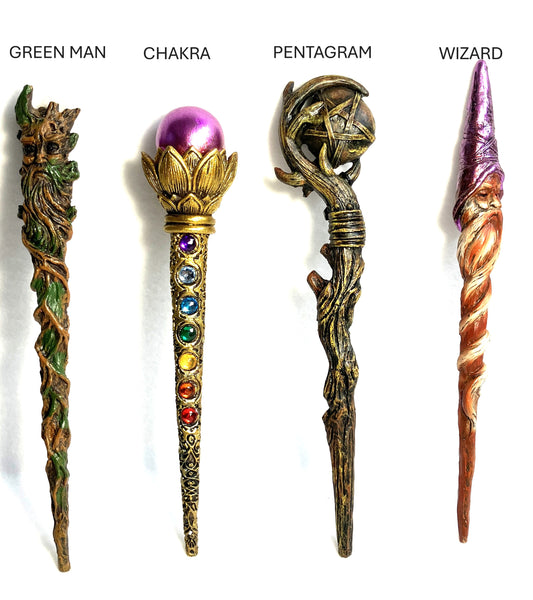 Four decorative wands labeled 'Green Man', 'Chakra', 'Pentagram', and 'Wizard' shown on a white background.