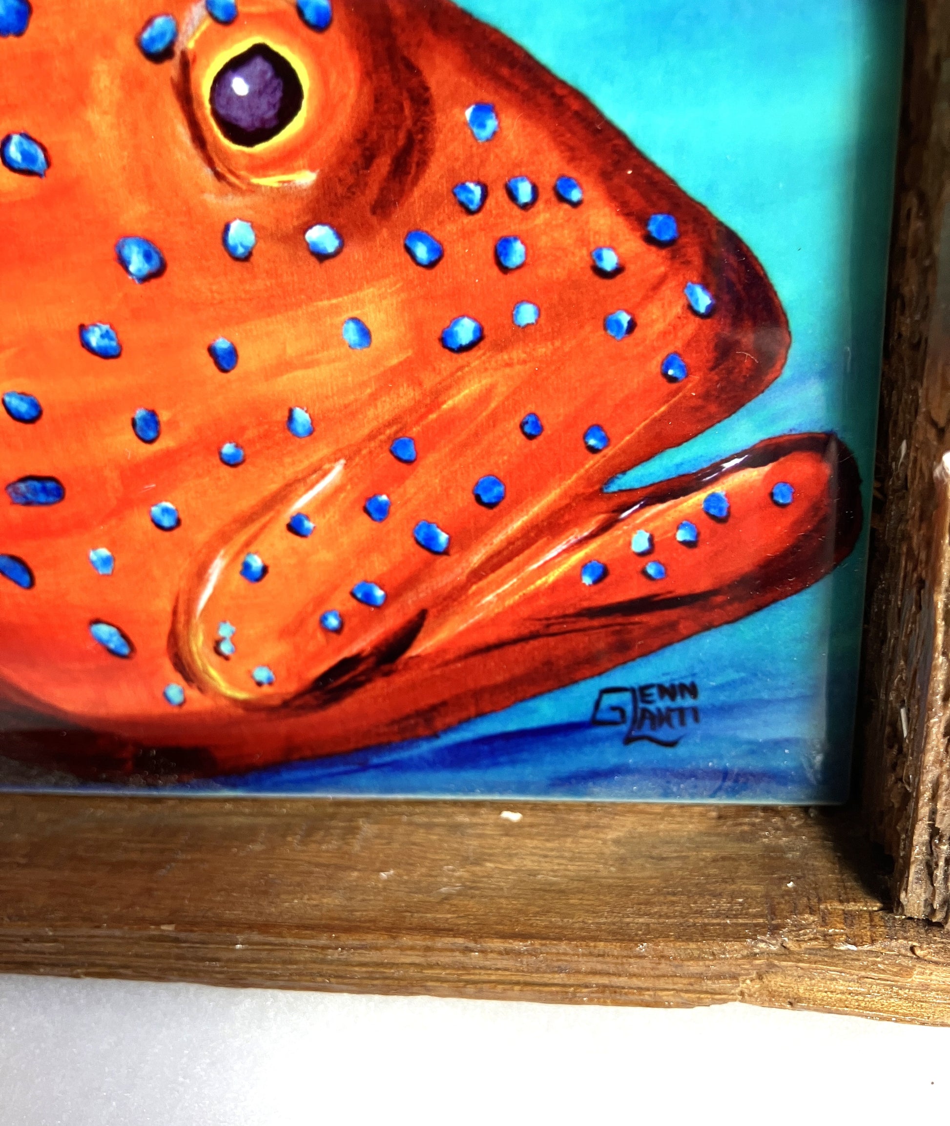 Closeup of a Coral Grouper in a Lobster Trap wooden frame showing the Artist's signature. 