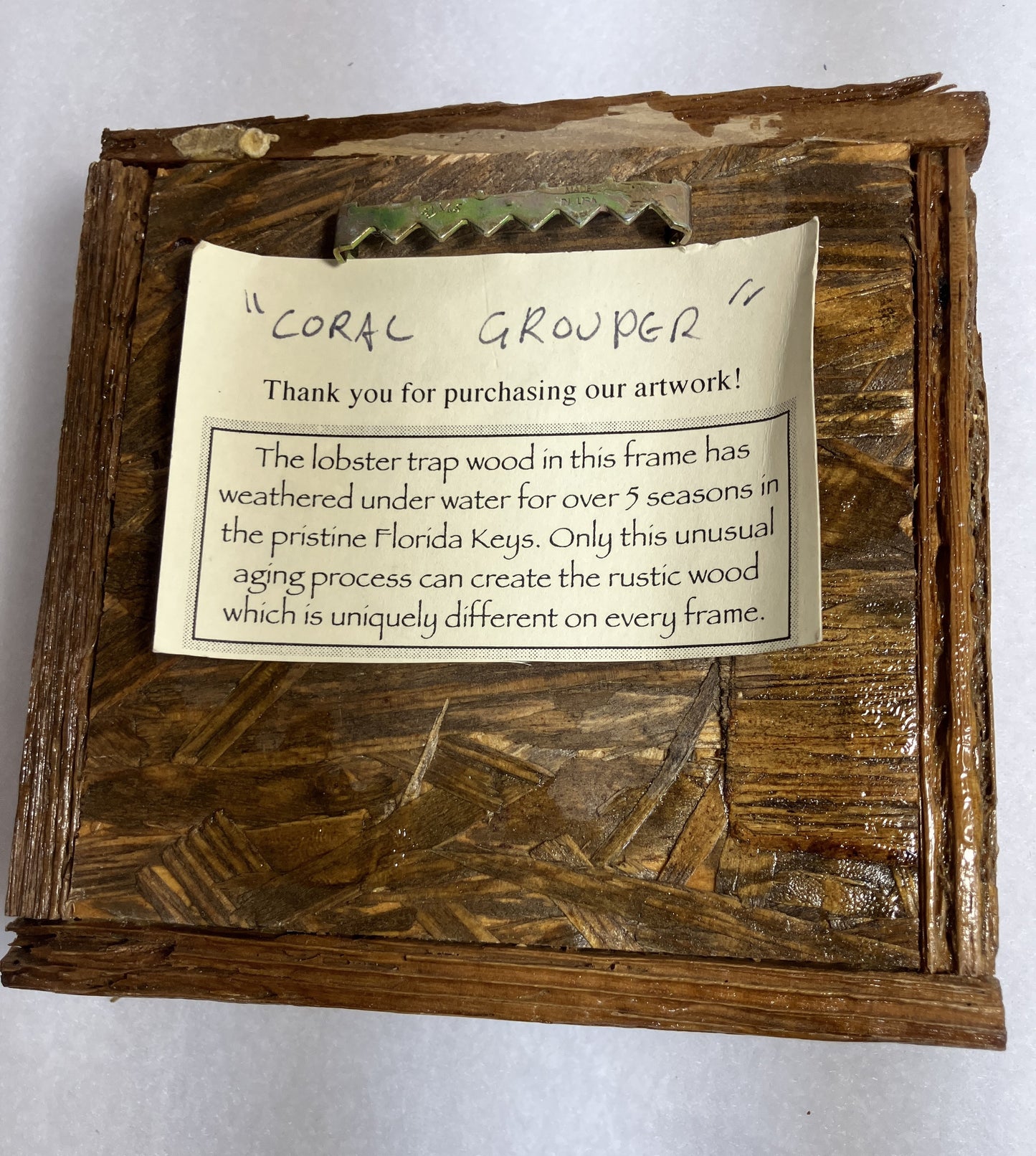 Wooden Lobster Trap frame with a label describing the origin of the frame
