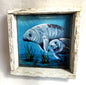 Framed artwork of Momma manatee and he Calf swimming underwater with a blue background.