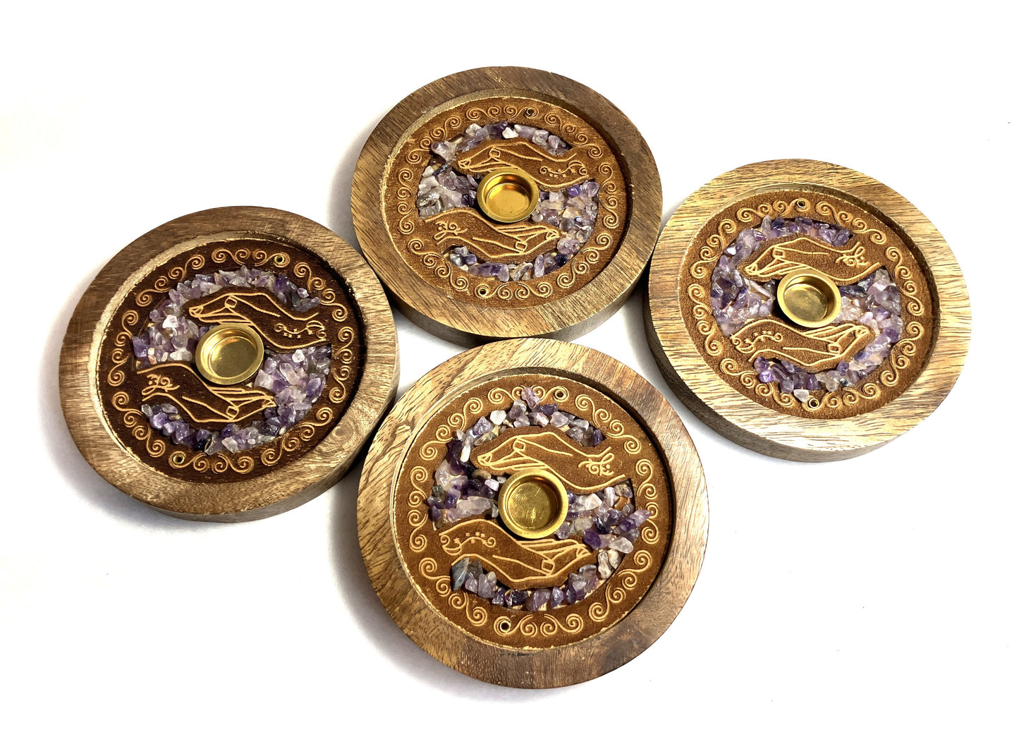 Four Mango wood and Amethyst crystals incense burners with decorative designs on a white background