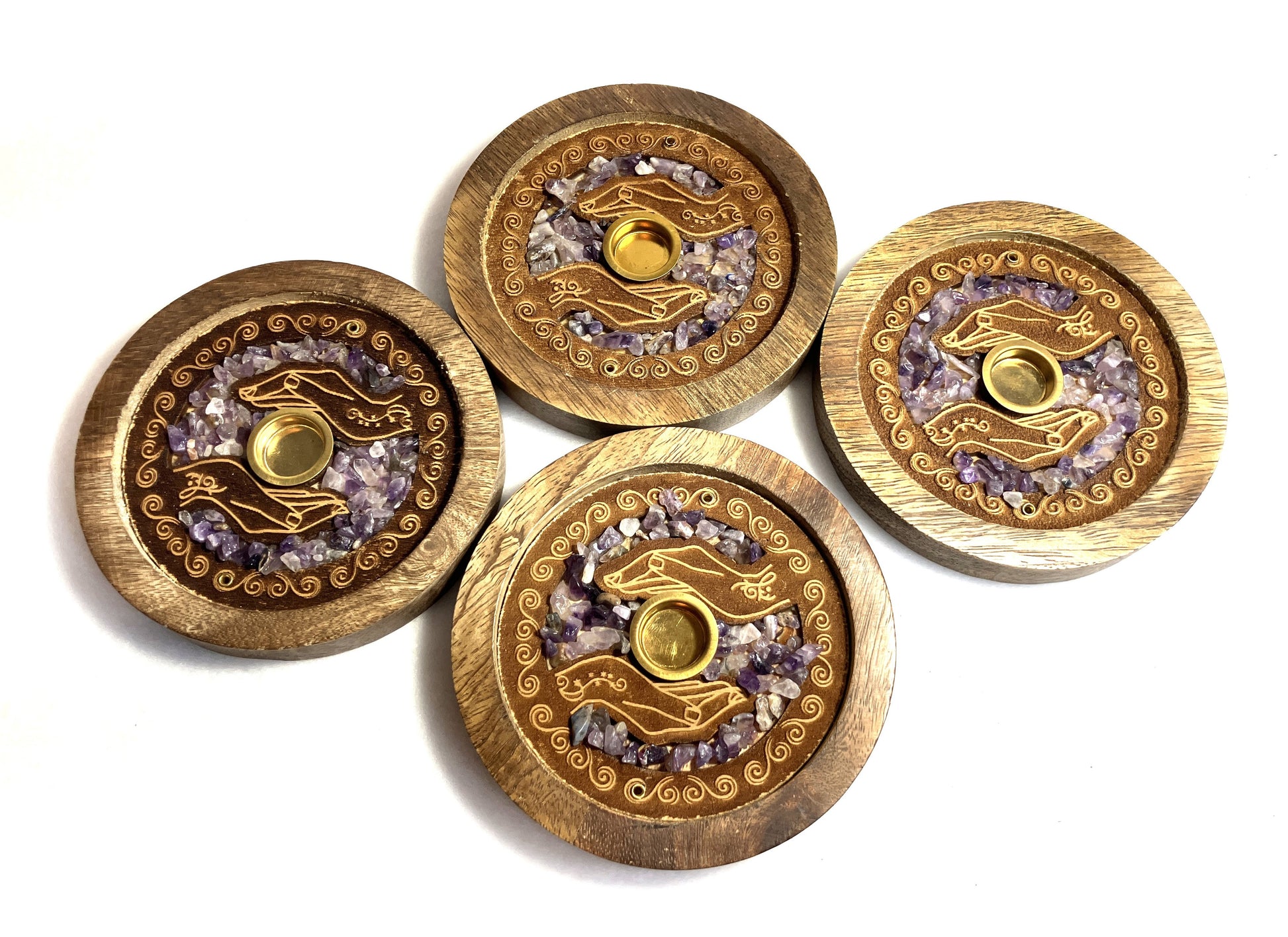 Four Mango wood and Amethyst crystals incense burners with decorative designs on a white background