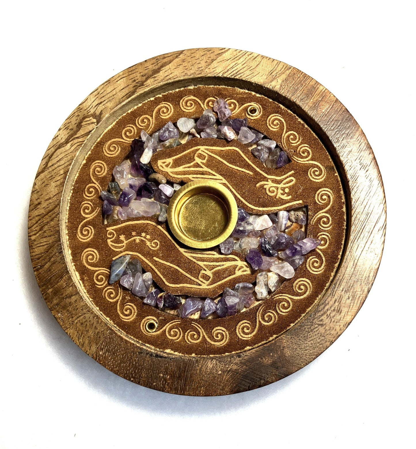 Closeup of the front of a Mango wood incense burner showing the detail of the decoration and Amethyst crystals