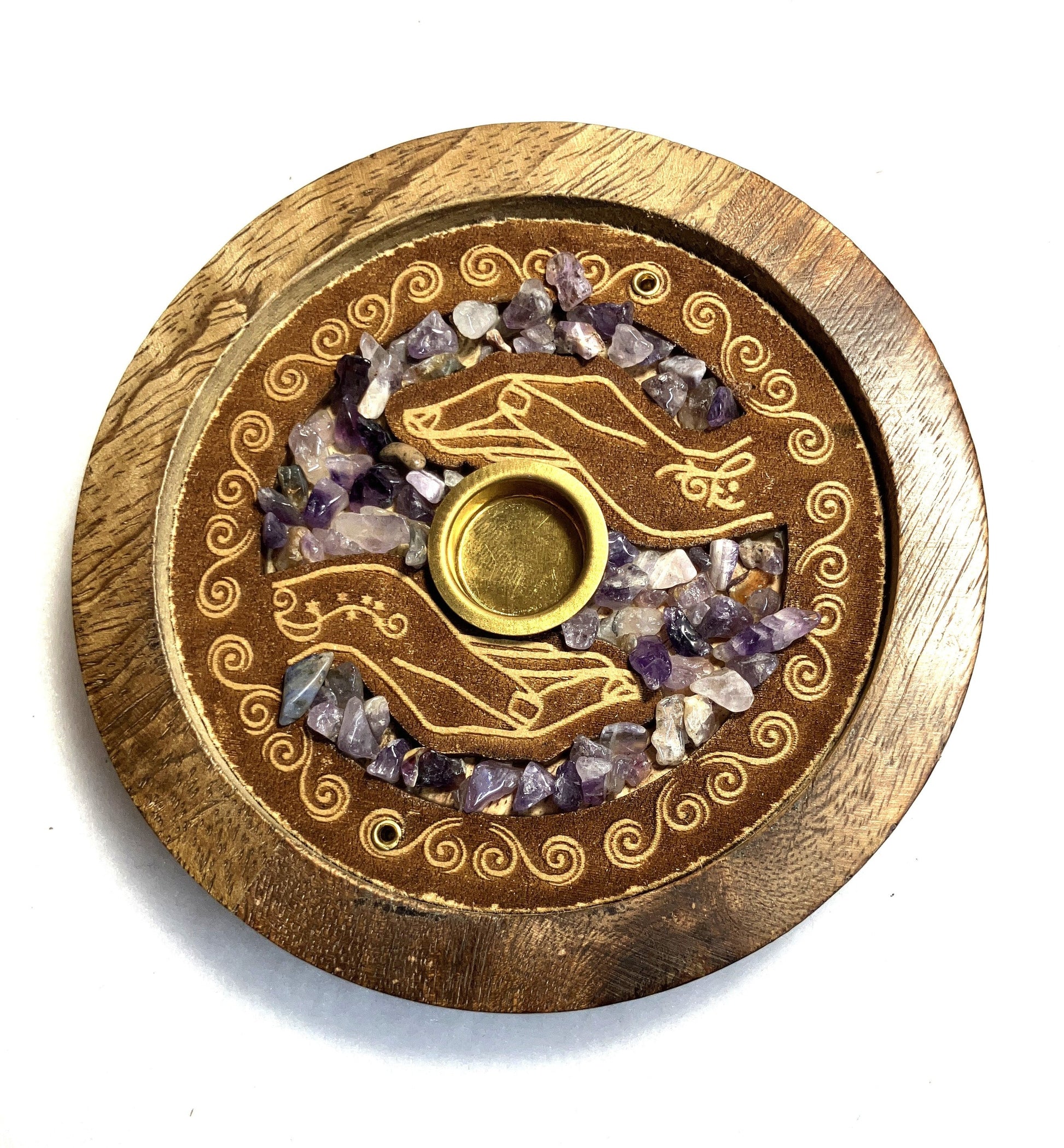 Closeup of the front of a Mango wood incense burner showing the detail of the decoration and Amethyst crystals