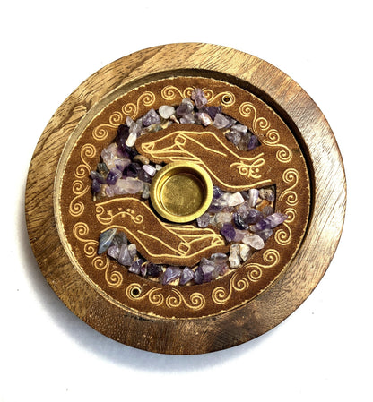 Closeup of the front of a Mango wood incense burner showing the detail of the decoration and Amethyst crystals