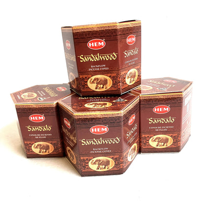 Group of HEM Sandalwood backflow incense cones shown on a white background