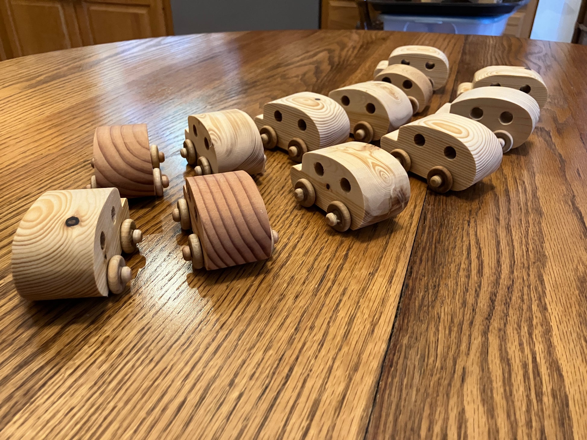 Wooden toy train cars on a wooden table