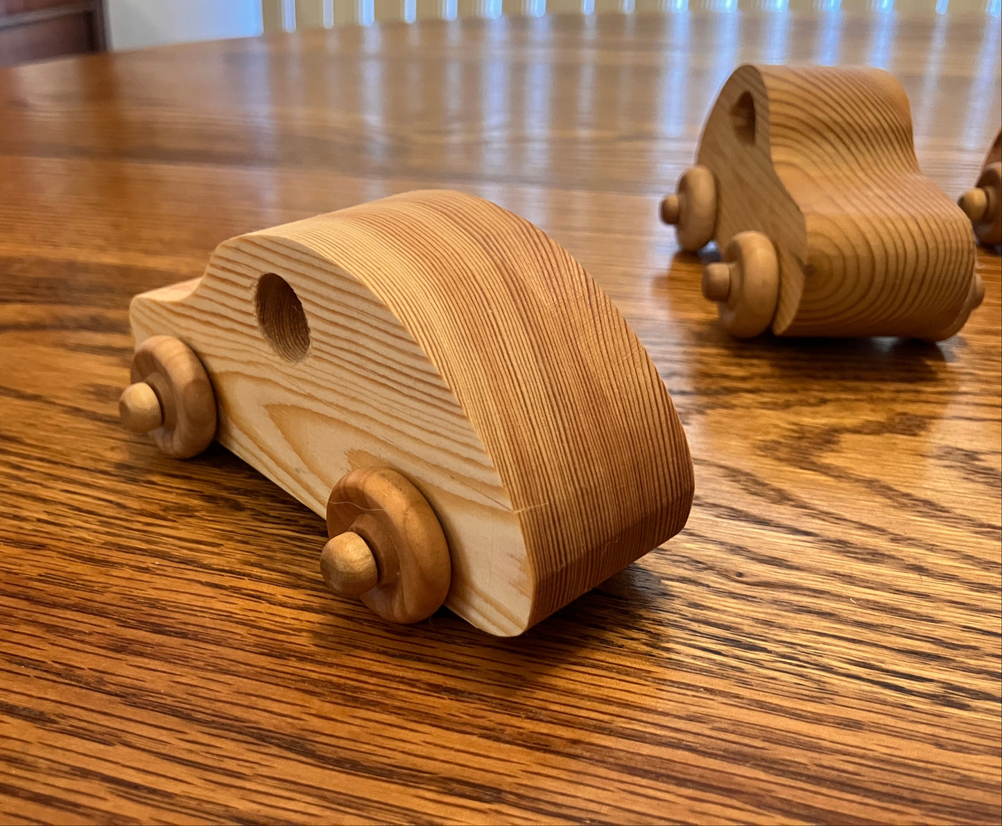 Wooden toy cars on a wooden table