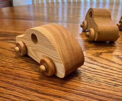 Wooden toy cars on a wooden table
