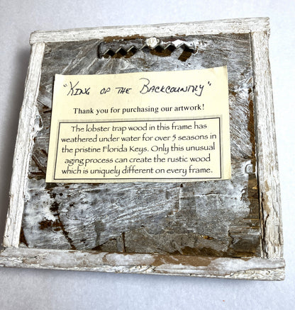 Back of frame with label — https://cdn.shopify.com/s/files/1/0694/0999/6976/files/IMG_Retrolusion_Lobster_Art_King_of_the_Backcountry_Back_photo_7_of_16_Listed_9-12-25_3201.jpg?v=1757704426