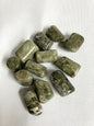 Front view of Vesuvianite Tumbled Crystals on a white fabric background