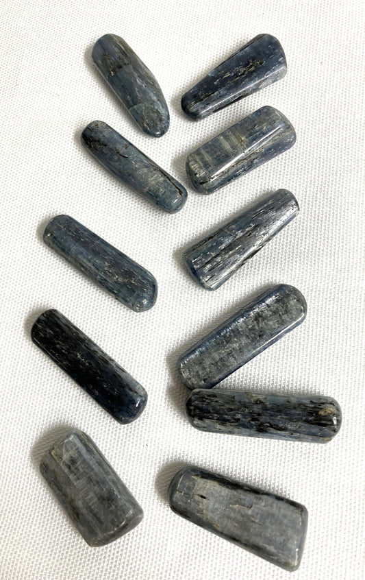 Blue Kyanite Crystals on a white fabric background