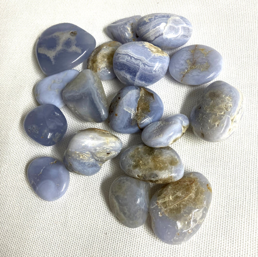 Group of Blue Lace Agate Crystals on a textured white surface