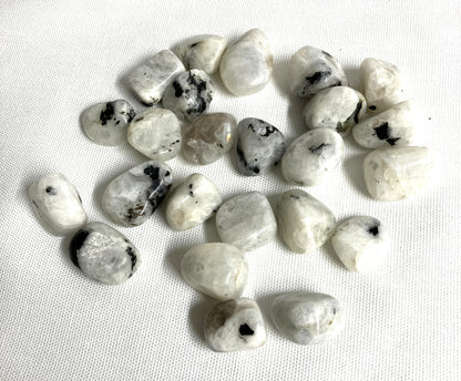 Rainbow Moonstone Crystals  on a white fabric background