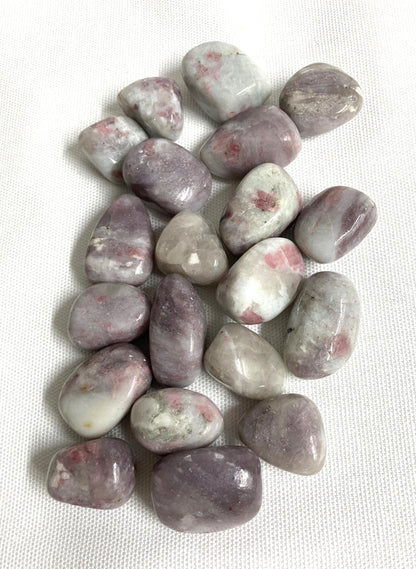 Front view of Pink Tourmaline Crystals on a white fabric background