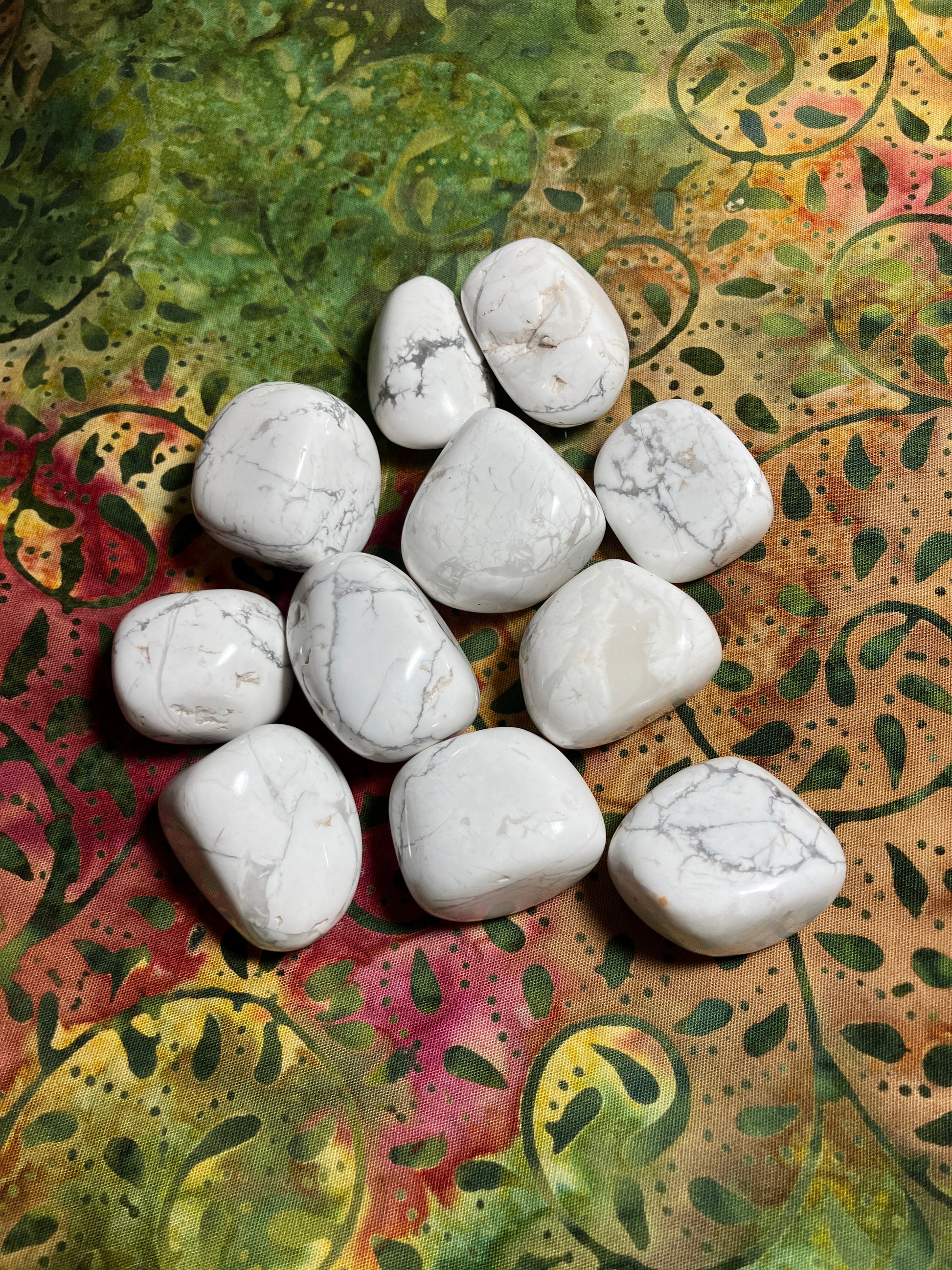 Group of Howlite Crystals  on a colorful, patterned fabric background