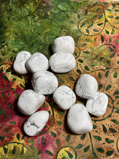 Howlite Crystals  on a colorful, patterned fabric background