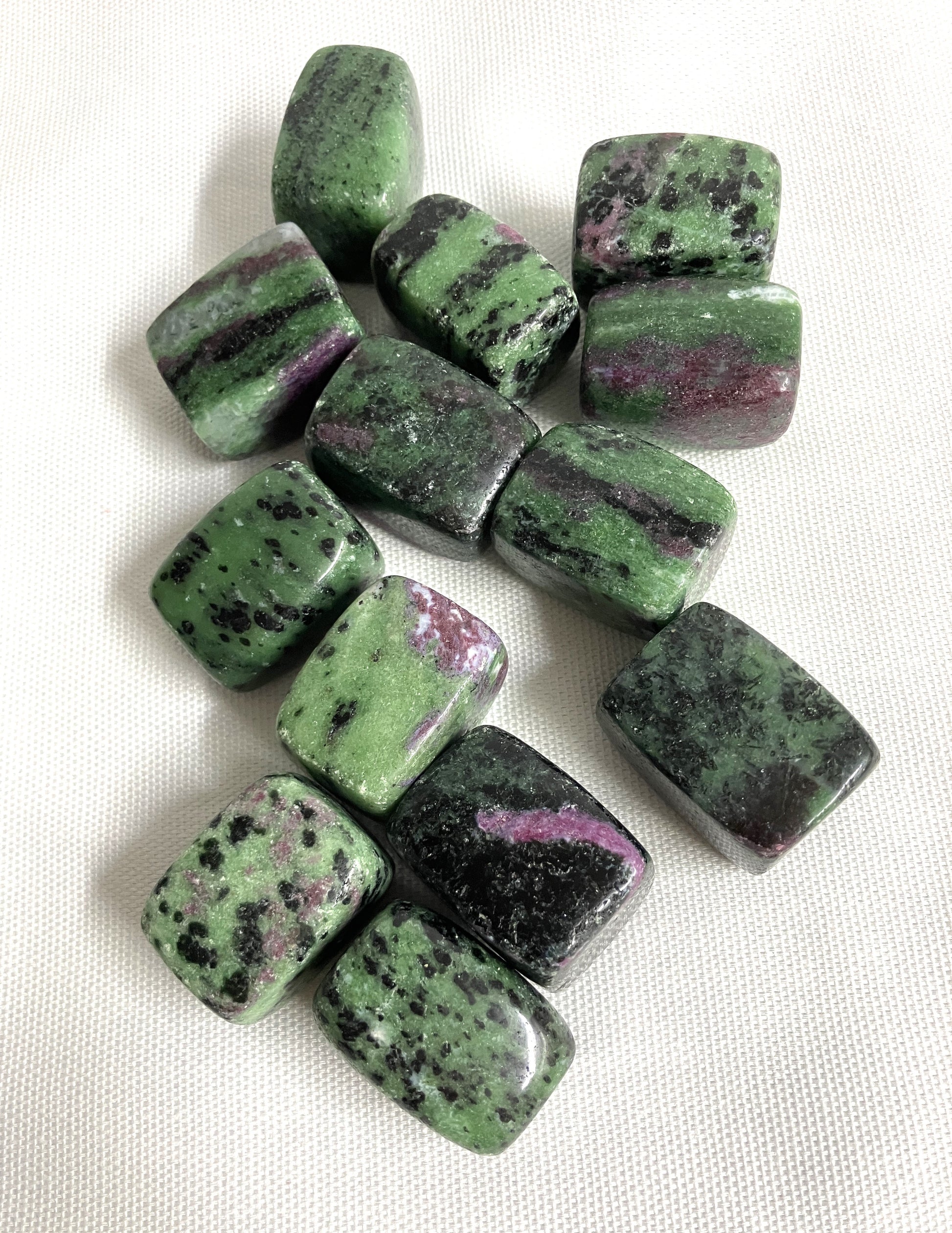 Ruby in Zoisite Crystals showing the Green and purple coloring on a white background