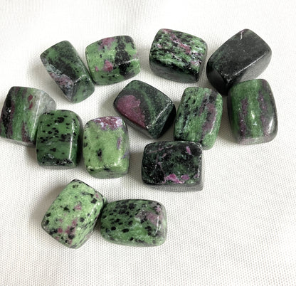 Bottom view of Ruby in Zoisite Crystals on a white fabric background