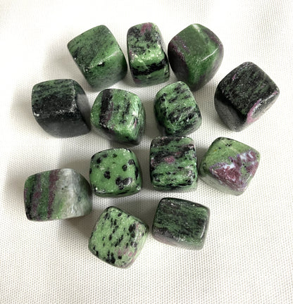 Top view of Ruby in Zoisite Crystals on a white fabric background