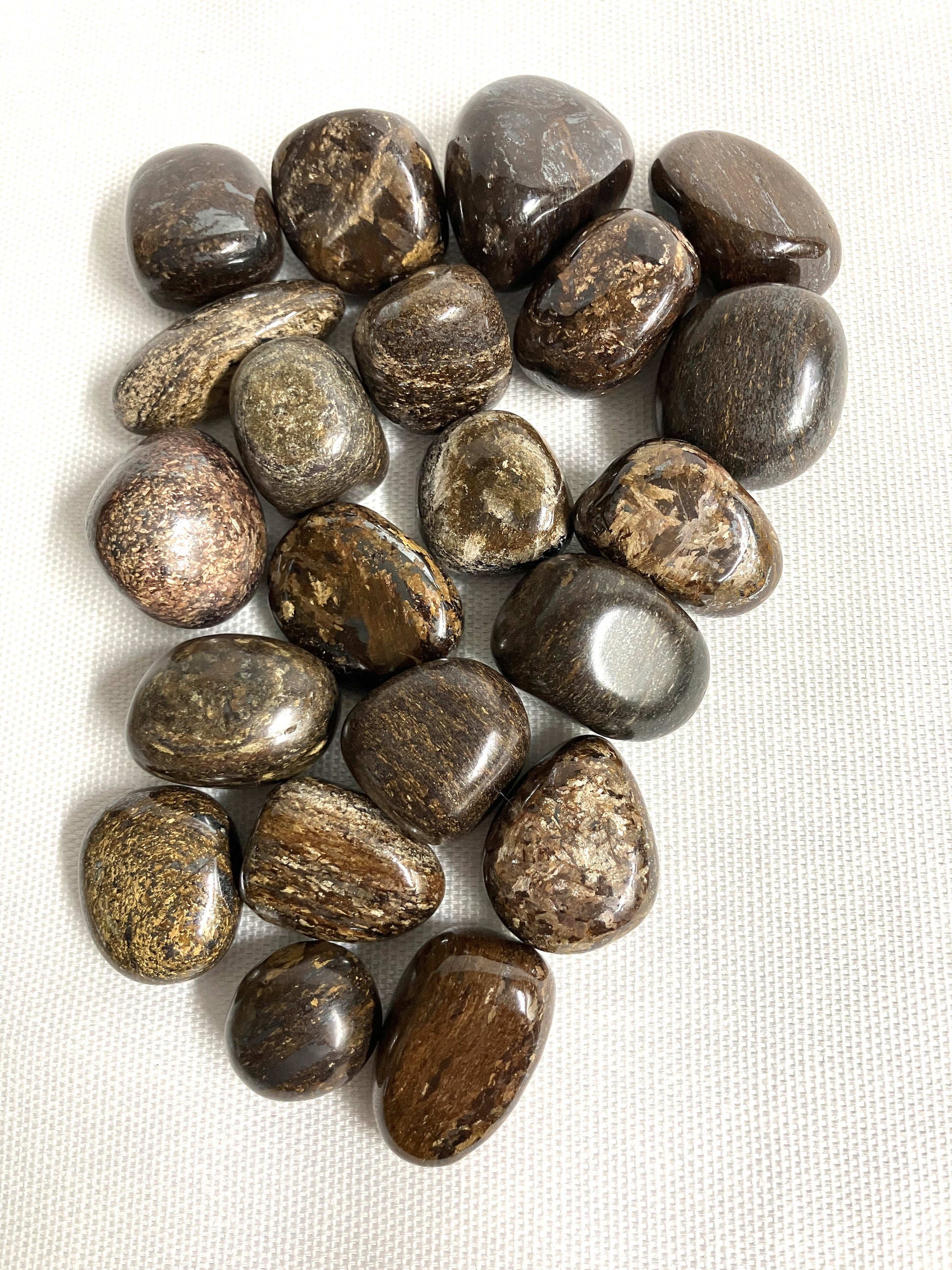 Tumbled Bronzite Crystals on a white background