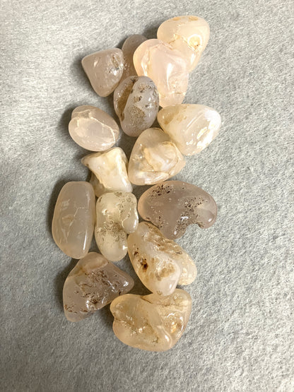 Front view of Pink Chalcedony Crystals on a gray surface