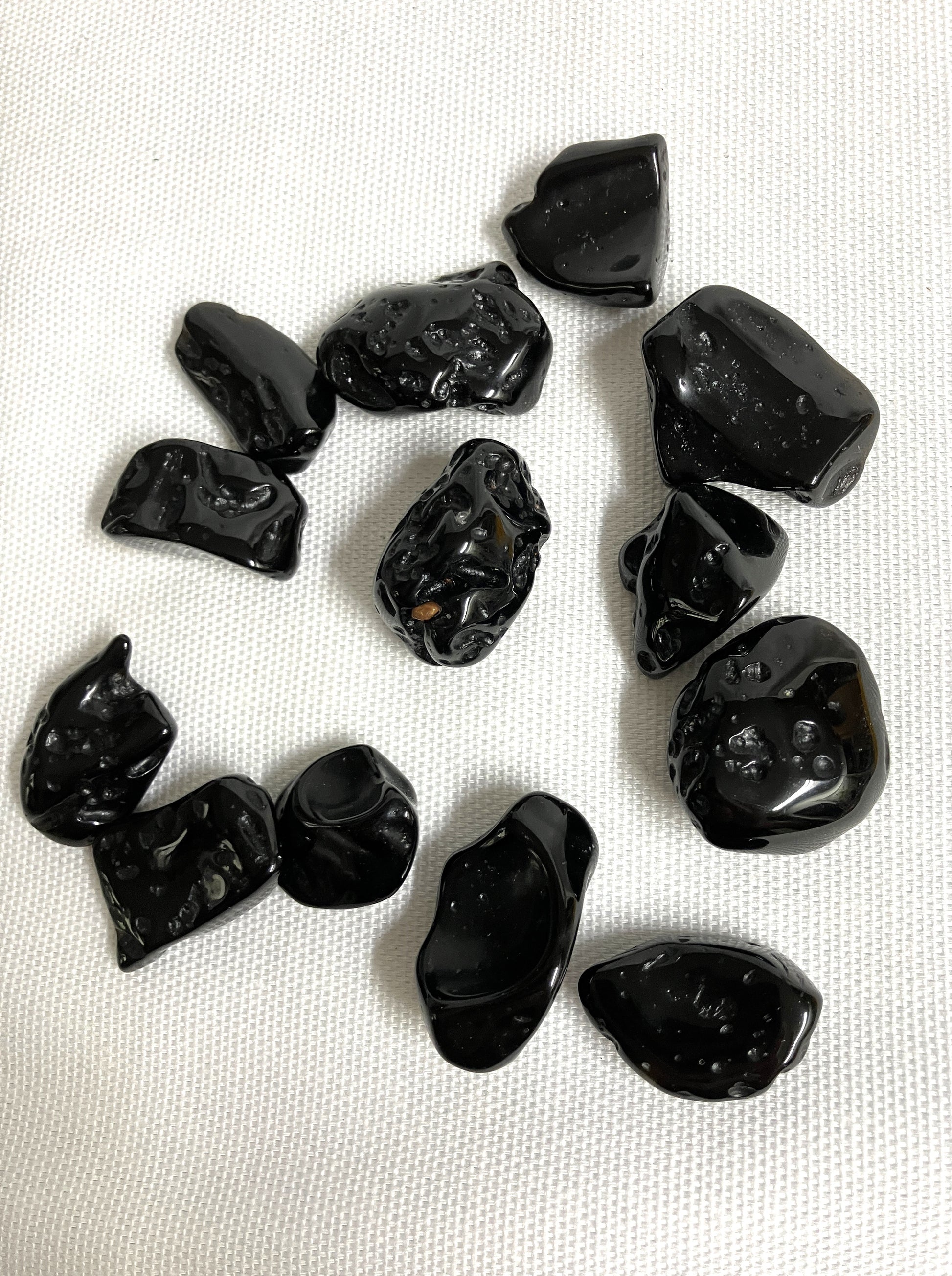 Back view of Tektite Stones on a white background
