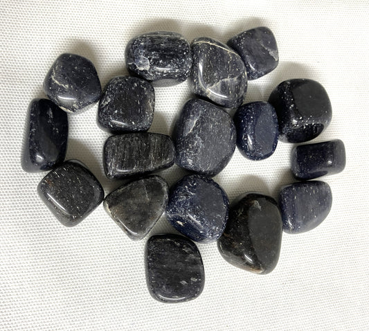 Top side of Blue Aventurine Tumbled Crystals on a white fabric background