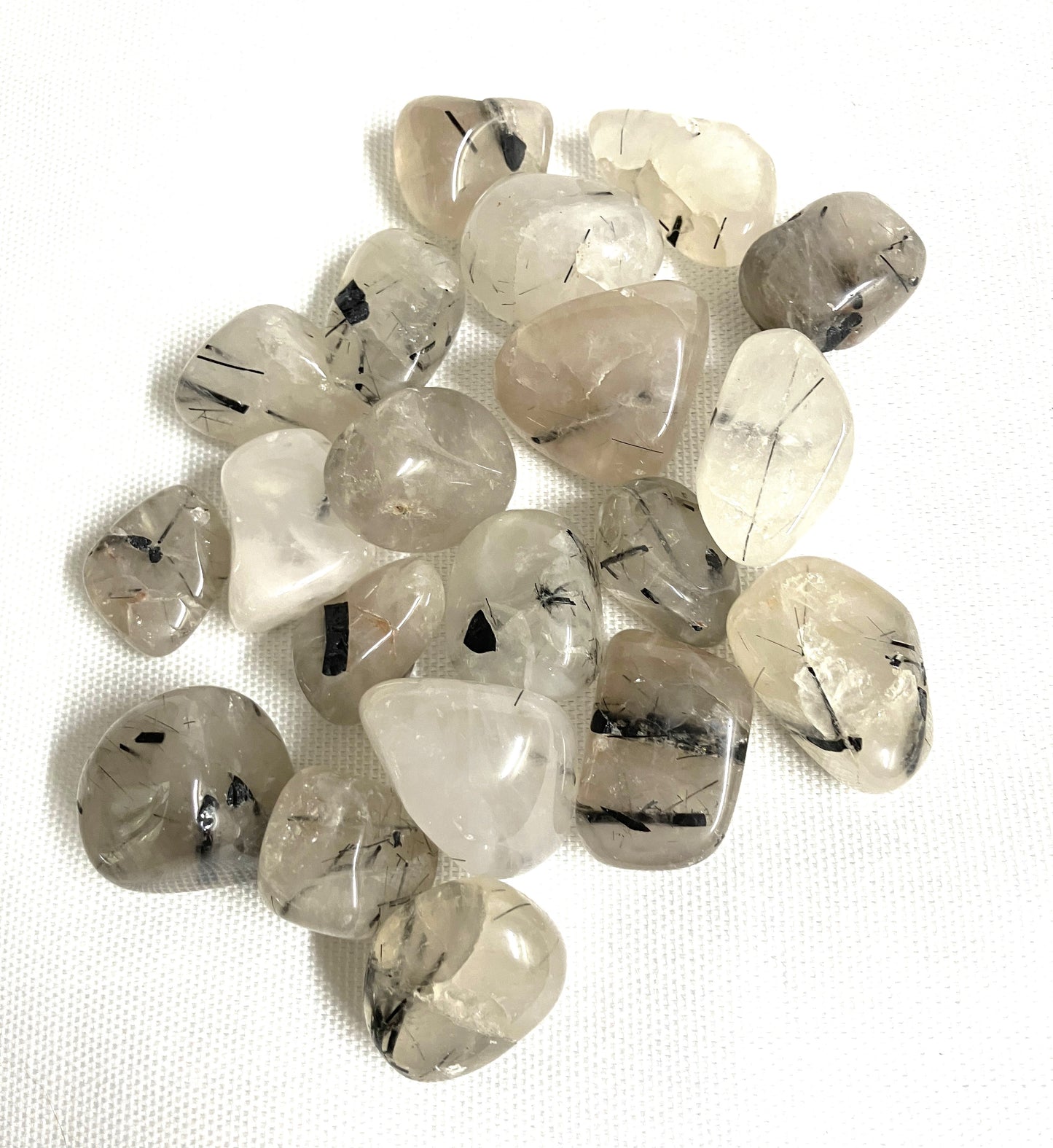 Back side of Tourmalinated Quartz Crystals on a white background