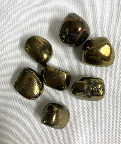 Peacock Ore Crystals AKA Chalcopyrite showing the back side on a white fabric background