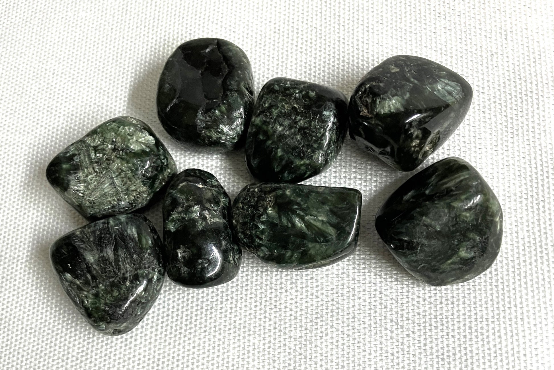 Closeup of Seraphinite Crystals on a white fabric background