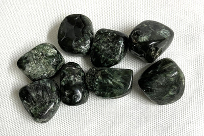 Closeup of Seraphinite Crystals on a white fabric background