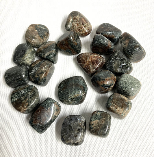 Group of Green Garnet Crystals on a white fabric background