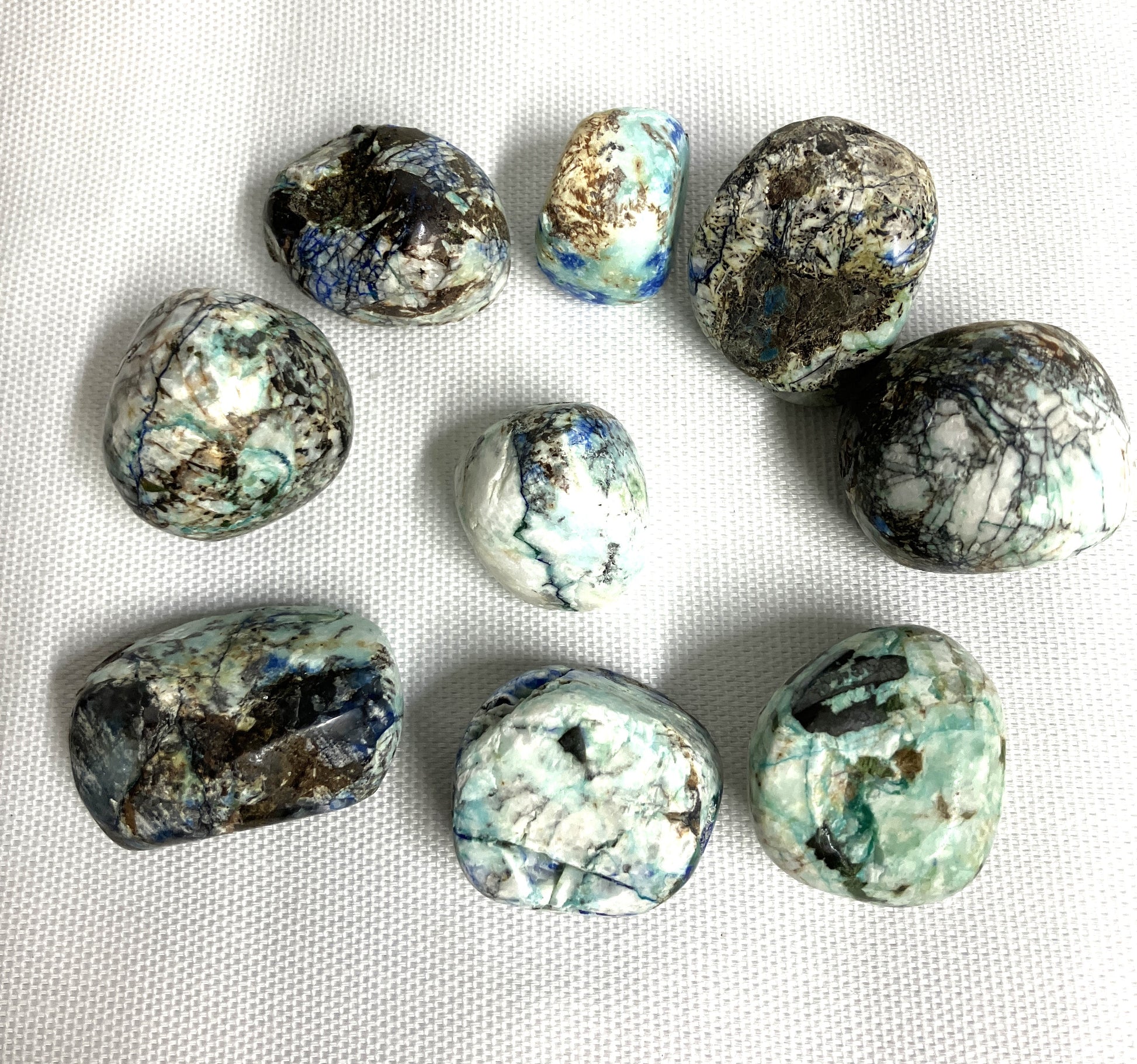 Back view of Azurite and Malachite Crystals on a white fabric background