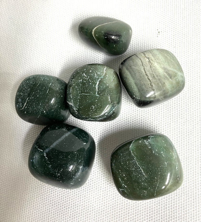 Showing the backside of some Bowenite tumbled crystals