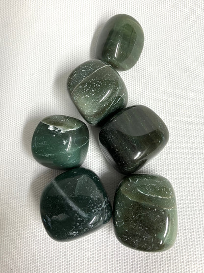 View of Bowenite displaying  an assortment of patterns  back side