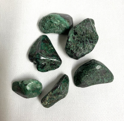 Front side of Cuprite Crystals on a white fabric background