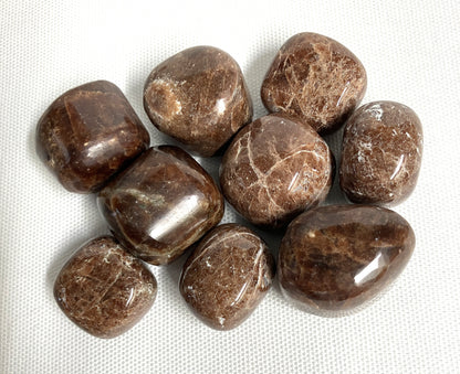 Closeup of Hessonite Garnet Crystals on a white fabric background