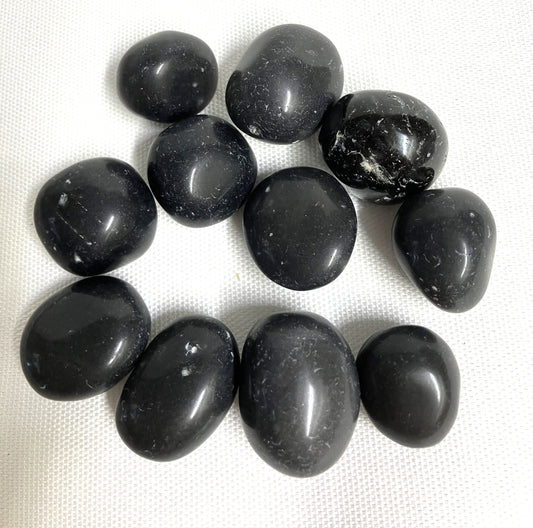 Black Agni Manitite Crystal aka Pearl of Fire shown in a grouping on a white background. 