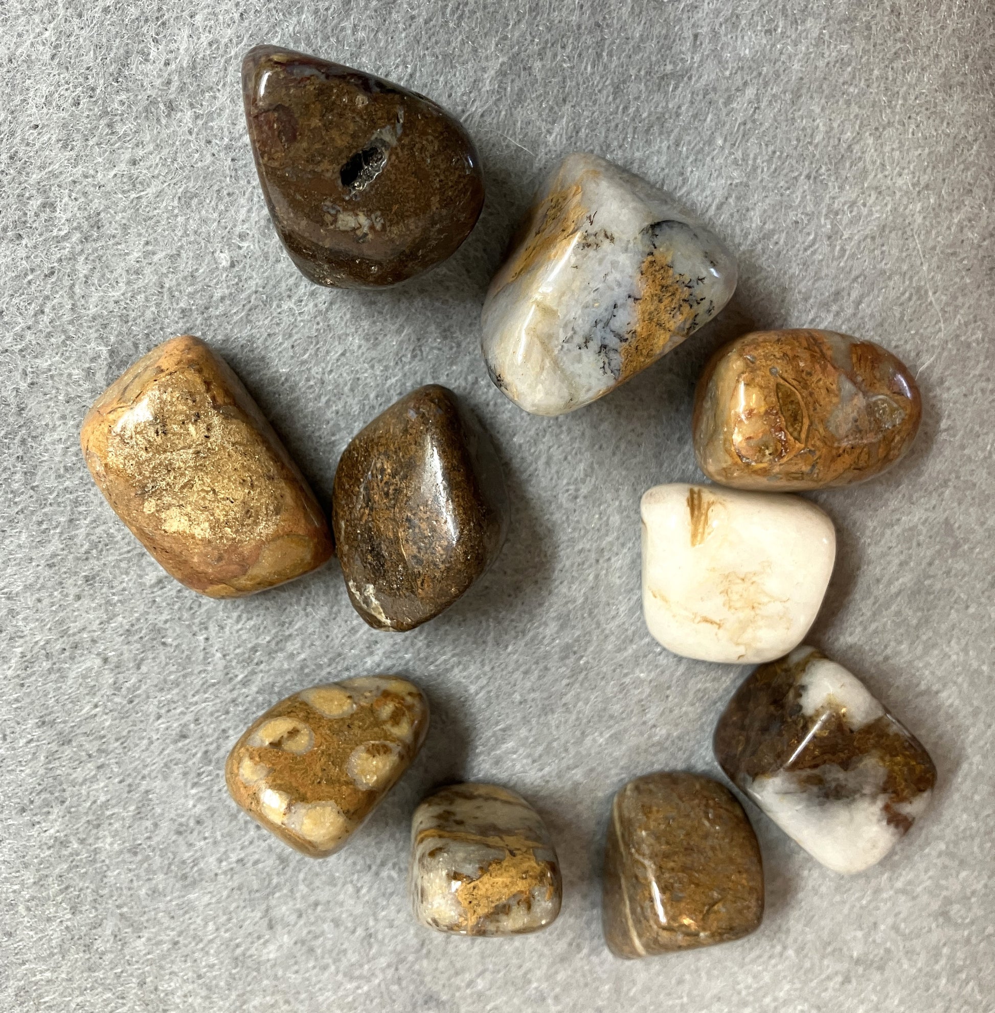 Front view of Pietersite Crystal AKA The Tempest Stone on a gray surface