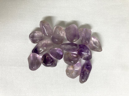Amethyst crystals on a light fabric background