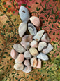 Front view of Botswana Agate Crystals on a patterned fabric background